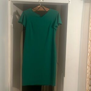 Green shirt sleeve dress with gold zipper up the back.  V neckline